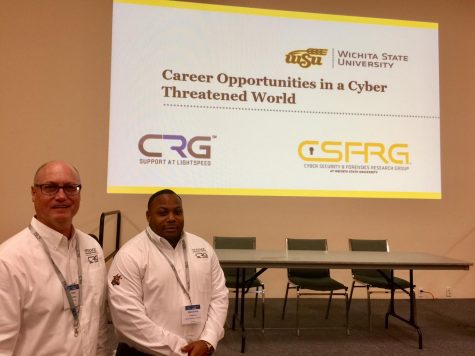 Matt Forney, left, with Wichita State and Mershard Frierson, right, with Cyber Research Group.