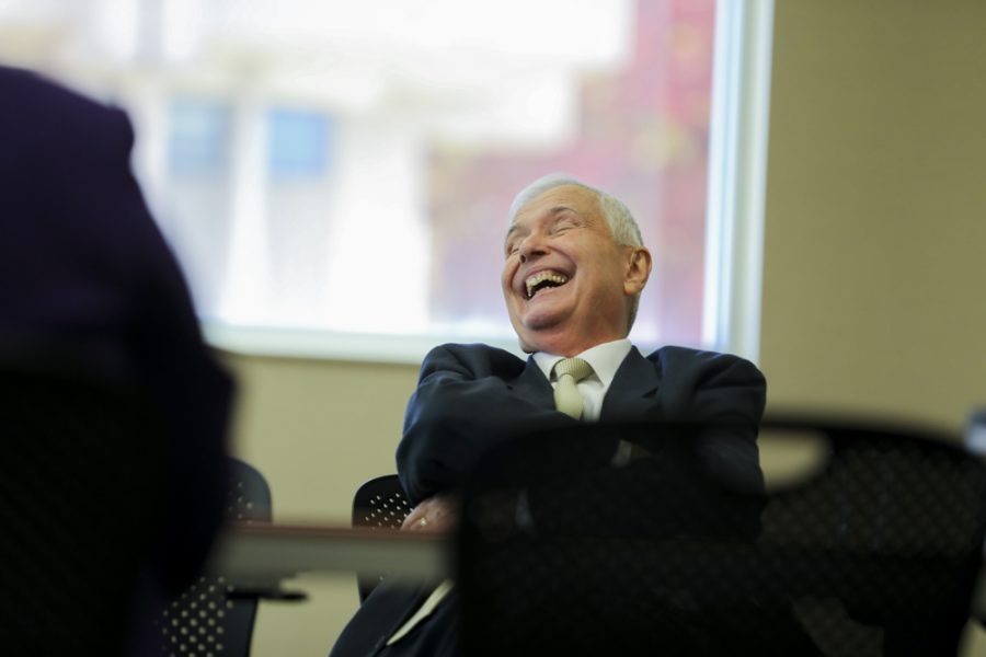 John Bardo, WSU president, laughs during the Council of Presidents during a Kansas Board of Regents meeting in the Rhatigan Student Center