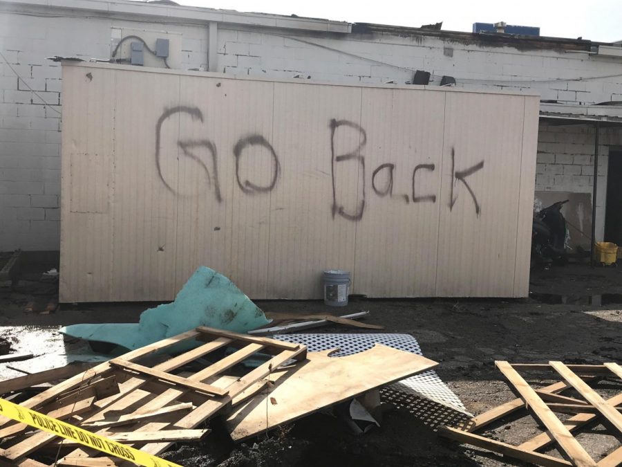 Graffiti was found in the remains of a fire that destroyed Petra Mediterranean Restaurant early Wednesday morning, around the back of the restaurant.