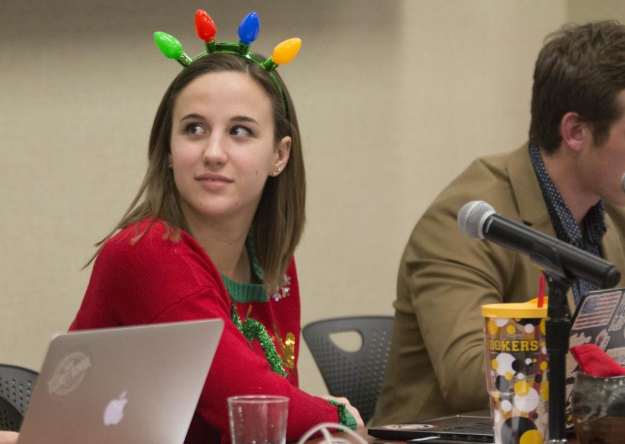 Student Body President Paige Hungate listens to a presentation during public forum.