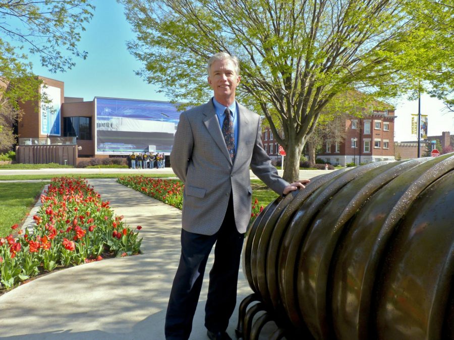 Bob Workman stands in front of the Ulrich Museum of Art, which he directs.