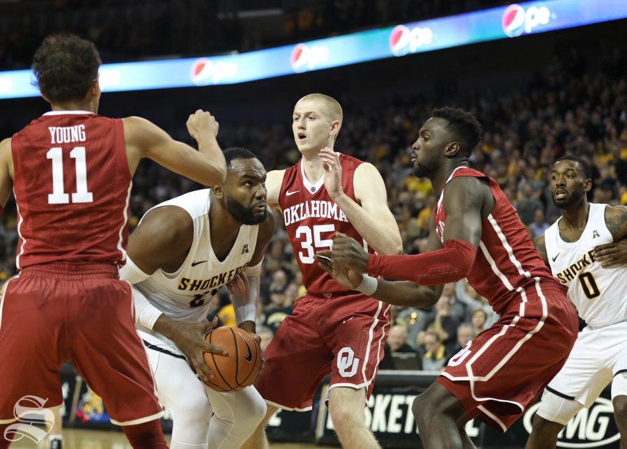 Wichita State center Shaquille Morris fights for a layup against the Oklahoma Sooners Saturday in Intrust Bank Arena.