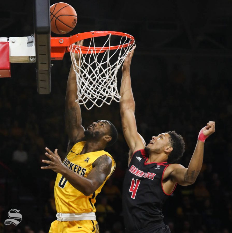 Wichita State forward Rashard Kelly goes to the basket against Arkansas State forward Tristin Walley during the first half in Koch arena