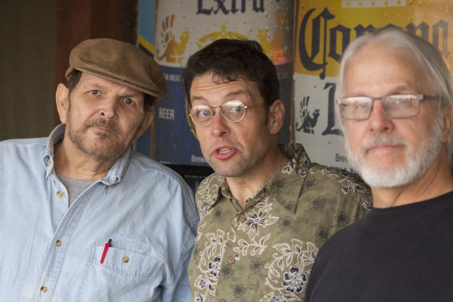 John Corkum (left), who sang for various local bands during the 1970s, Jay Price (center), and Ron Schauf (right), who played bass in local bands during the 1970s, pose for a photo at the book signing at Margaritas Cantina.