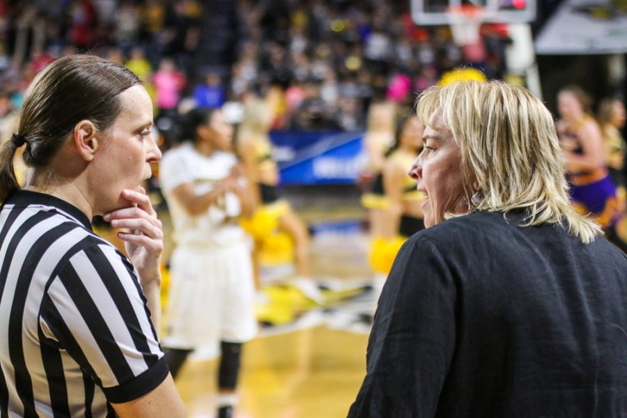 Wichita State head coach Keitha Adams discusses foul call with referee.