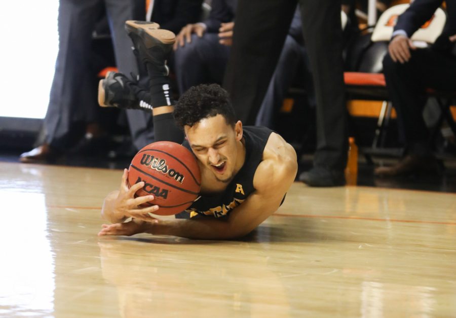 Wichita State guard Landry Shamet hits the ground after contact from a Oklahoma State player in Gallagher-Iba Arena on Saturday.
