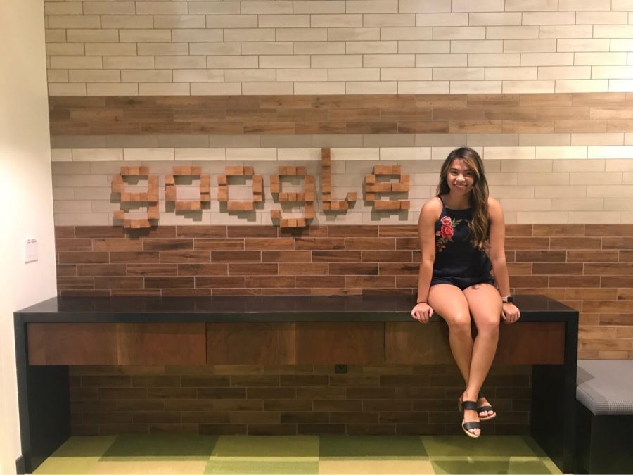 Camille Buranday poses next to a Google sign. Buranday attended Googles Computer Science Summer Institute the summer before her senior year of high school. 