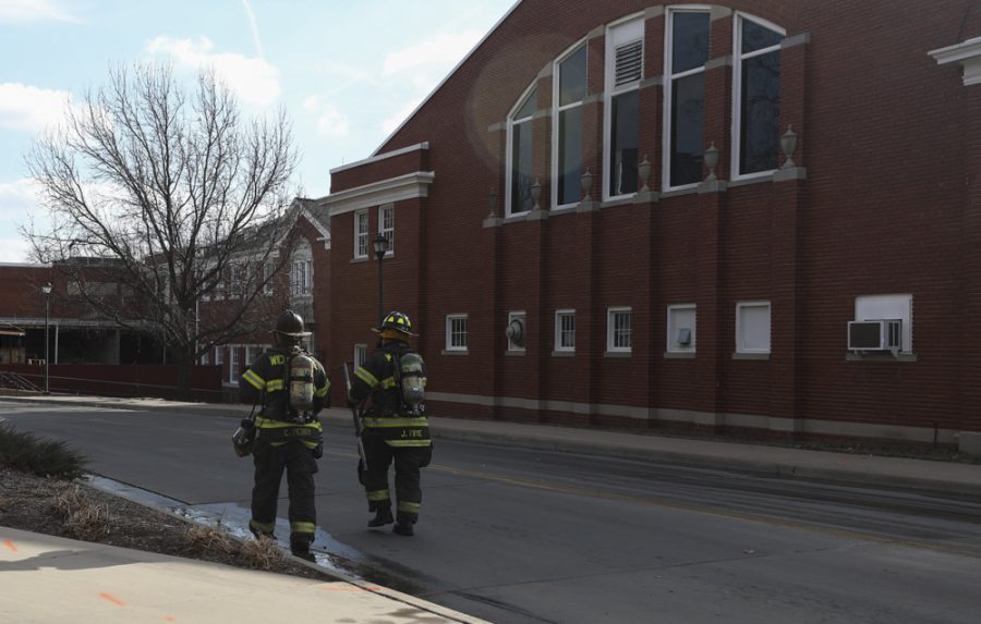 Firefighters respond to a call at Henrion Hall on Friday morning.