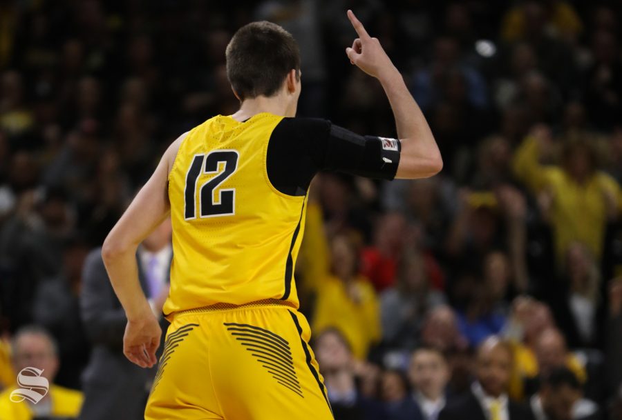 Wichita State guard Austin Reaves celebrates after a three point basket against the Tulsa Golden Hurricane during the first half at Koch Arena. 7-8
