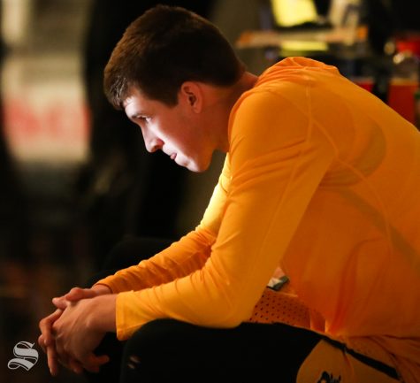 Wichita State guard Austin Reaves sits on the bench before being announced at the game against the UCF Knights at Koch Arena.