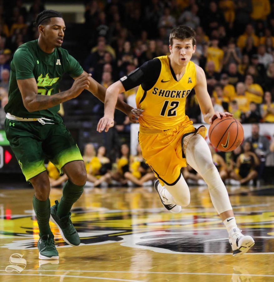 Wichita State guard Austin Reaves drives to the basket against South Florida forward Tulio Da Silva during the first half in Koch Arena.