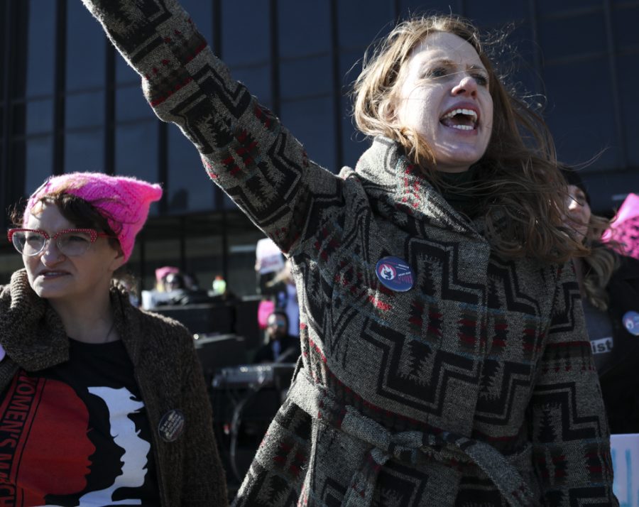 Lacey Cruse leads the crowd in a chant encouraging people to vote during the Womens March on Air Capital in front of Wichita City Hall.