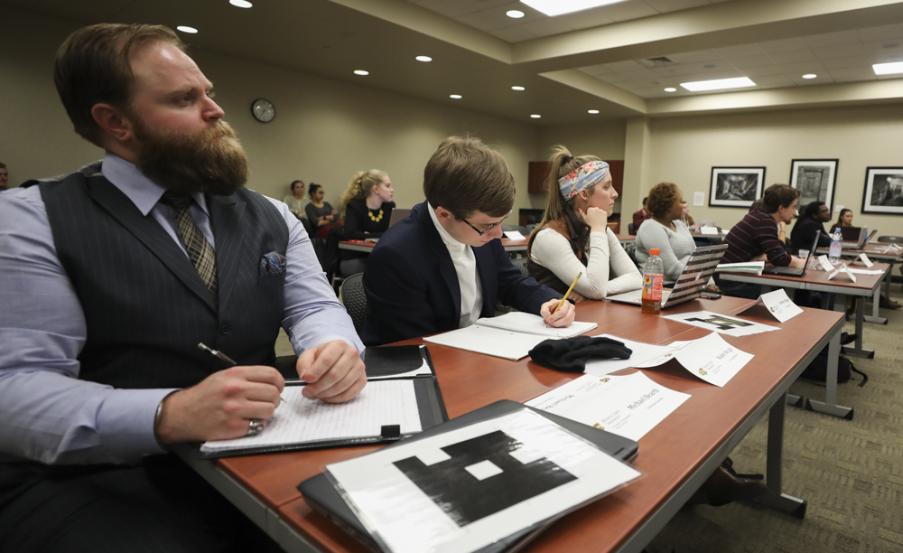 Senators Michael Bearth, Walter Wright, and Courtney Wages listen as Vice President Breck Towner addresses senate during the February 7, 2018 meeting.