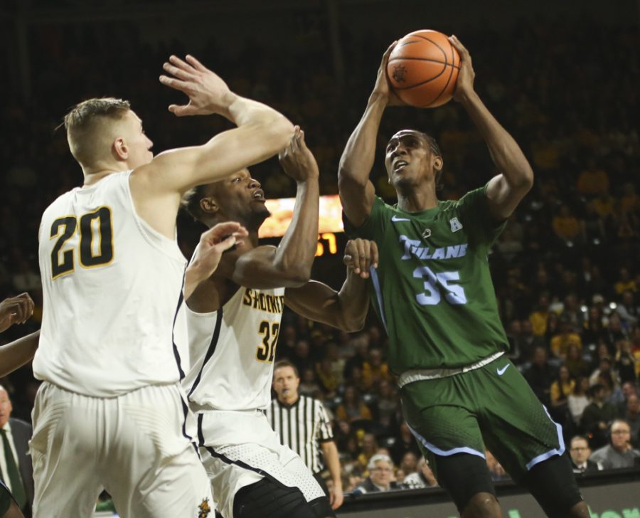 At the start of second half, Tulane guard Melvin Frazier looks to shoot over Wichita State center Rauno Nurger and forward Markis McDuffie at Koch Arena.
