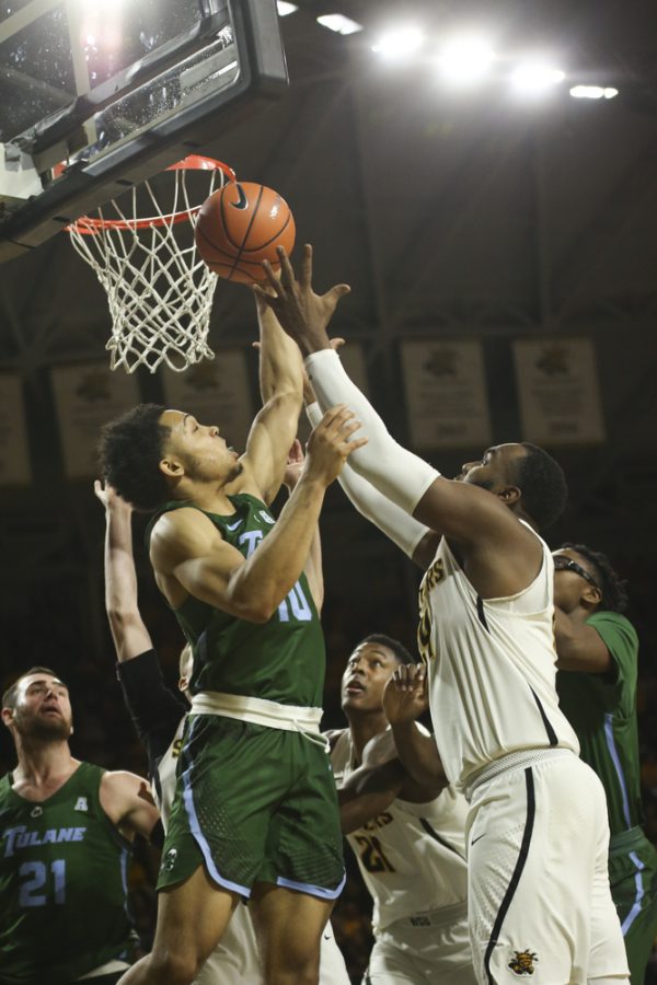 Wichita State center Shaquille Morris tries to rebound against Tulane guard Caleb Daniels during the second half at Koch Arena.