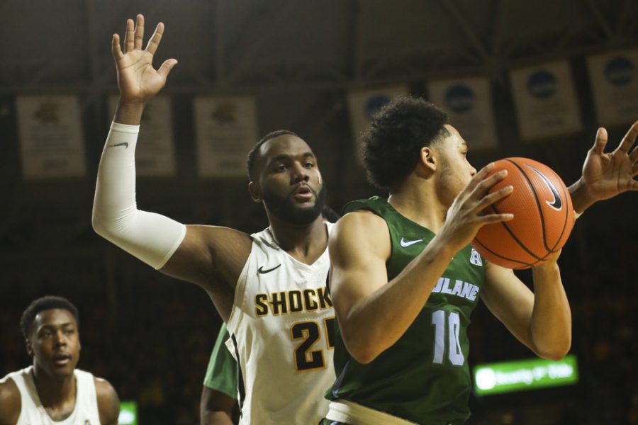 Wichita State center Shaquille Morris guards the ball against Tulane guard Caleb Daniels during the second half at Koch Arena.