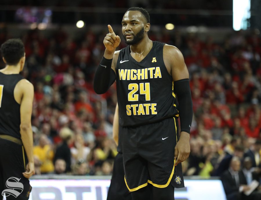 Wichita State center Shaquille Morris points at the rim after a foul Sunday against Cincinnati.