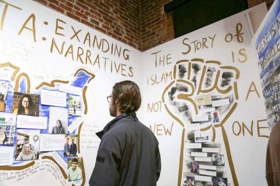 People look at the artwork at the Muslim Student Association's Shiftspace gallery at February's Final Friday.