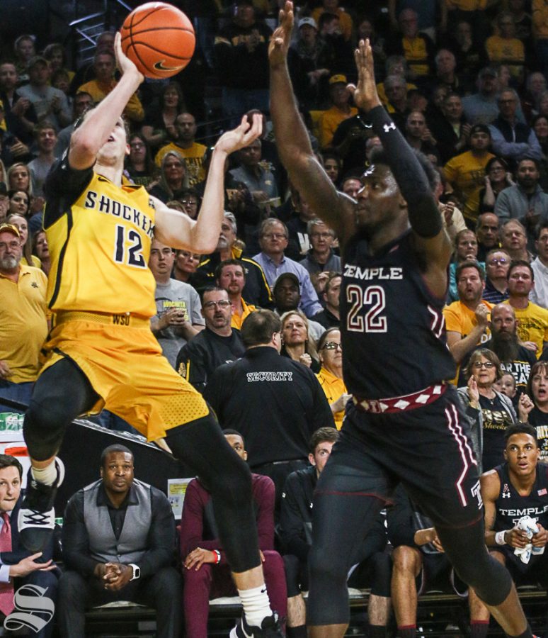Wichita State guard Austin Reaves shoots against Temple forward DeVondre Perry during the first half at Koch Arena.