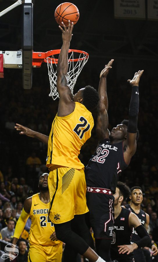 Wichita State forward Darral Willis Jr. scores on Temple forward DeVondre Perry during the first half at Koch Arena.