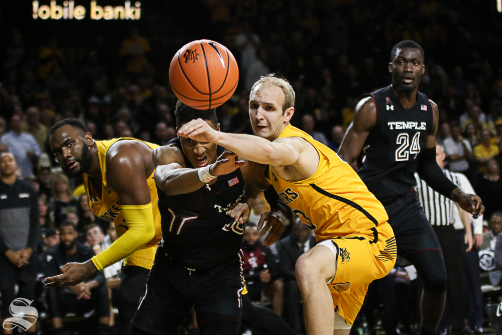 Wichita State guard Conner Frankamp and Temple guard Nate Pierre-Louis hustle for a rebound during the second half at Koch Arena. 