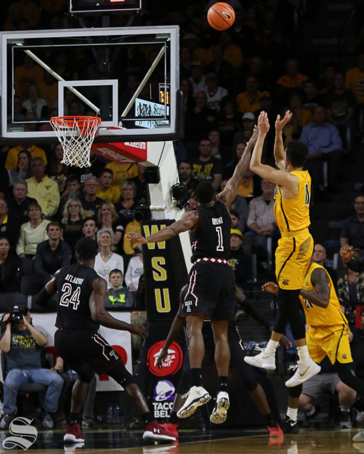 Wichita State guard Landry Shamet shoots over Temple guard Josh Brown during the second half at Koch Arena.