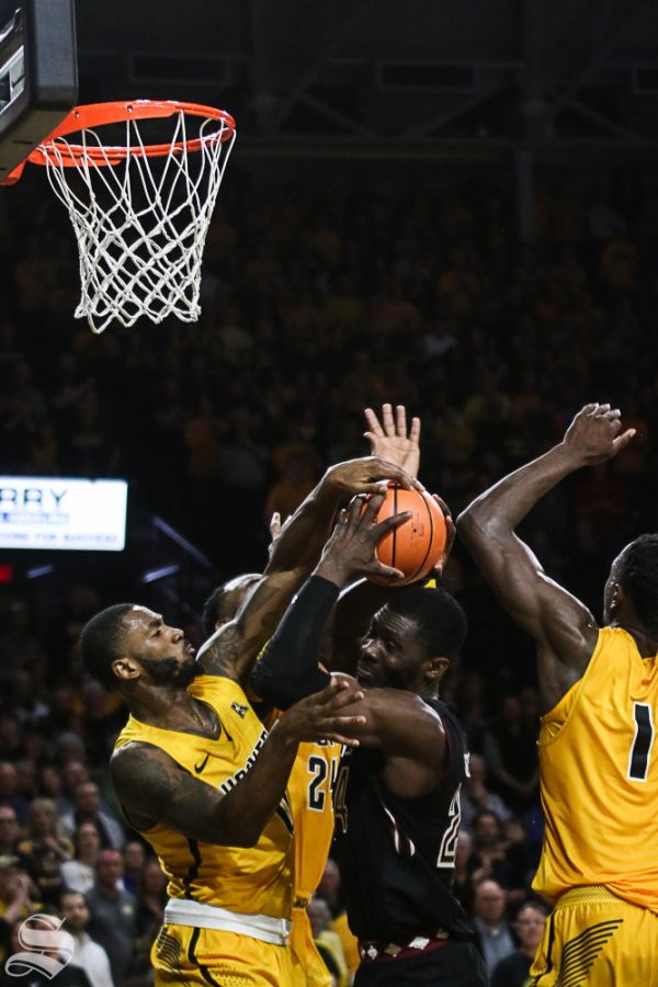 Wichita State forward Rashard Kelly blocks a shot by Temple center Ernest Aflakpui during the second half at Koch Arena.
