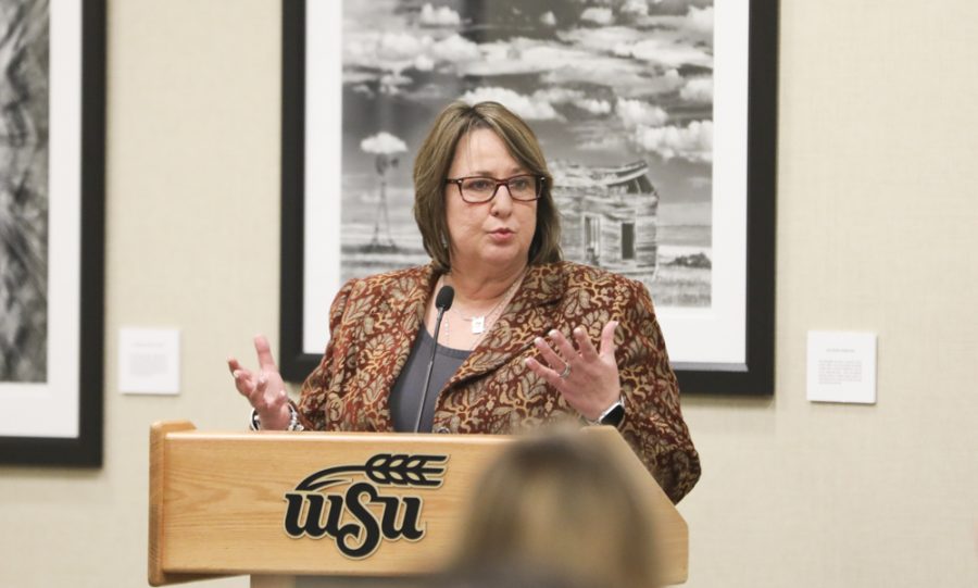Vice President for Student Affairs Teri Hall speaks at the SGA meeting Wednesday about tabling the student fees discussion until the fees committee reconvenes in public.