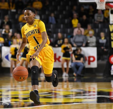 Wichita State guard Keke Thompson drives the ball down court during the first quarter of the game against the Houston Cougars at Koch Arena.