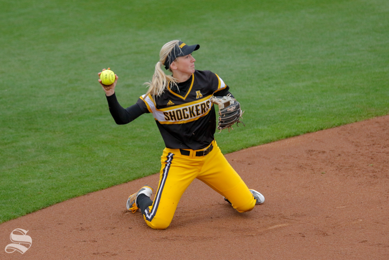 Wichita State's Laurie Derrico throws to first base during their game on March 27, 2018 in Stillwater, Oklahoma.