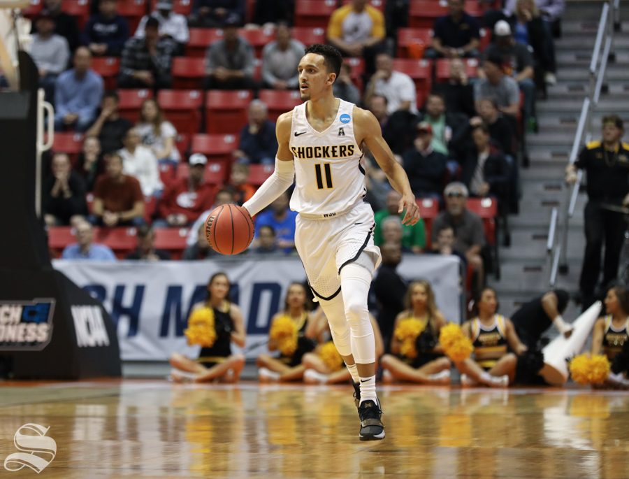Wichita State guard Landry Shamet (11) brings the ball down the court during the First Round game of the NCAA men’s college basketball tournament in San Diego.