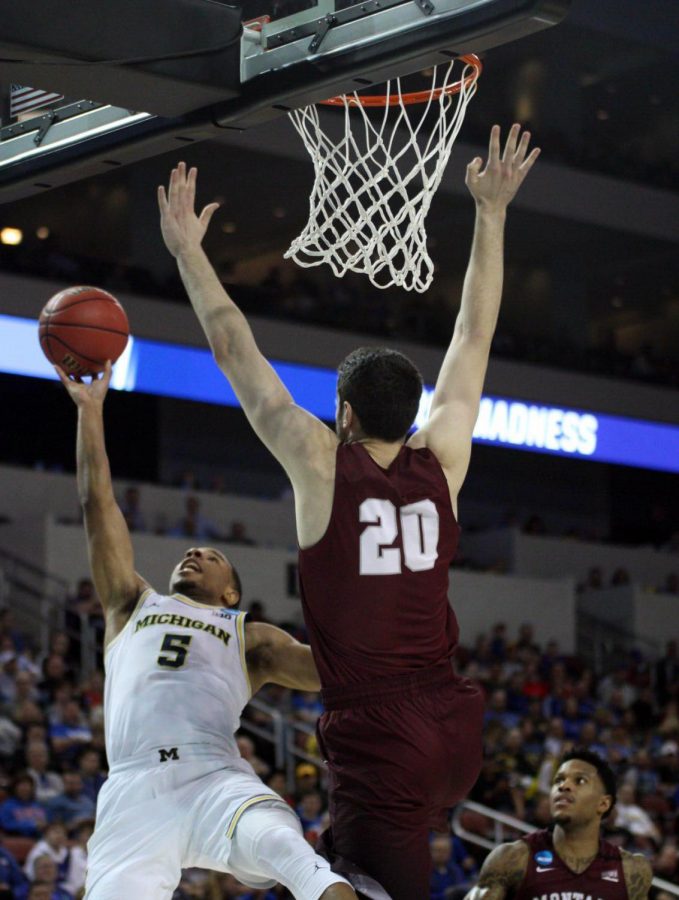 Michigan's Jaaron Simmons makes a shot against Montana. 