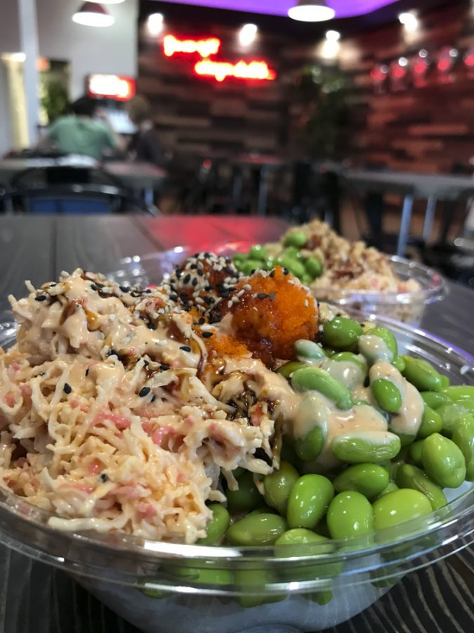 A fresh bowl of Poke' artfully prepared with spicy tuna and smoked salmon, drizzled with eel sauce and tangy mustard is one of many combinations available at Poke' Mix.