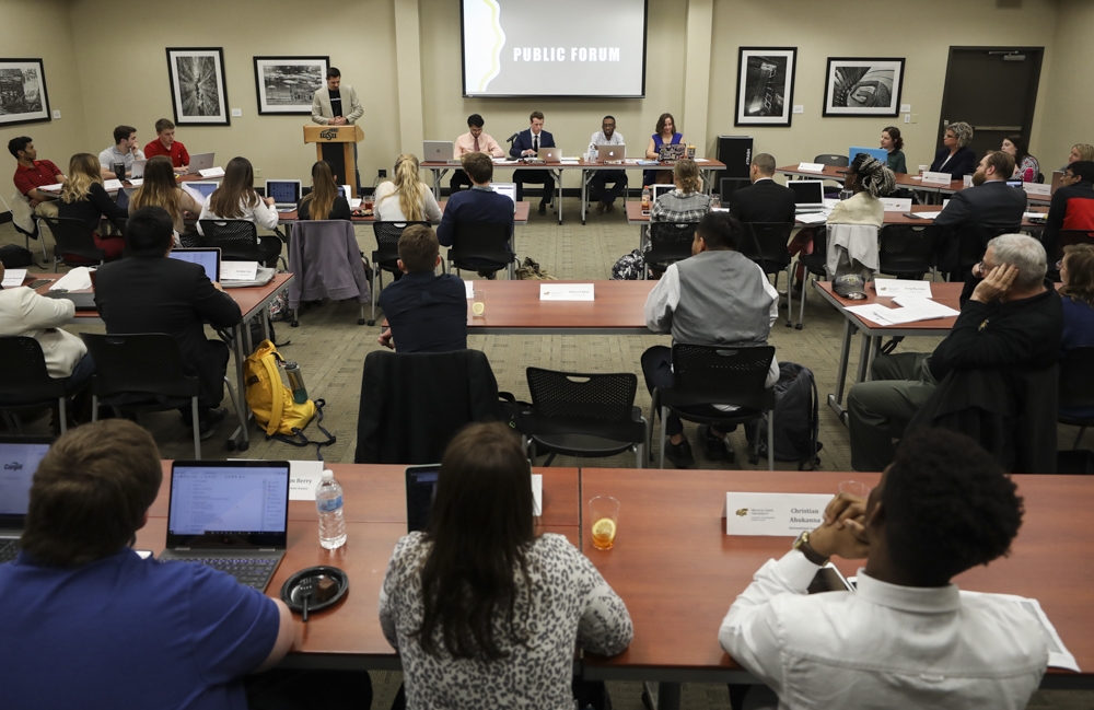 Student Senate listens as The Sunflower Ad Manager Christian Yost answers questions about ad revenue.