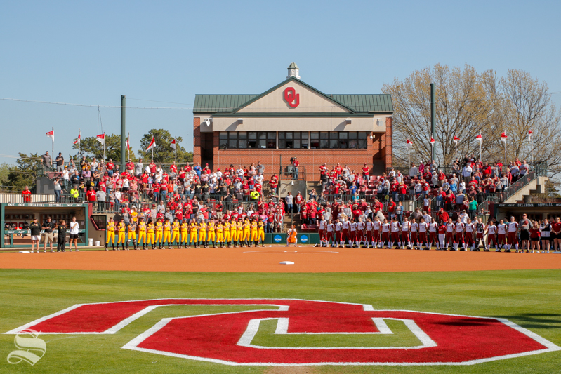 Wichita State and the University of Oklahoma stand together for the National Anthem before their game at Marita Hynes Field on April 11, 2018.