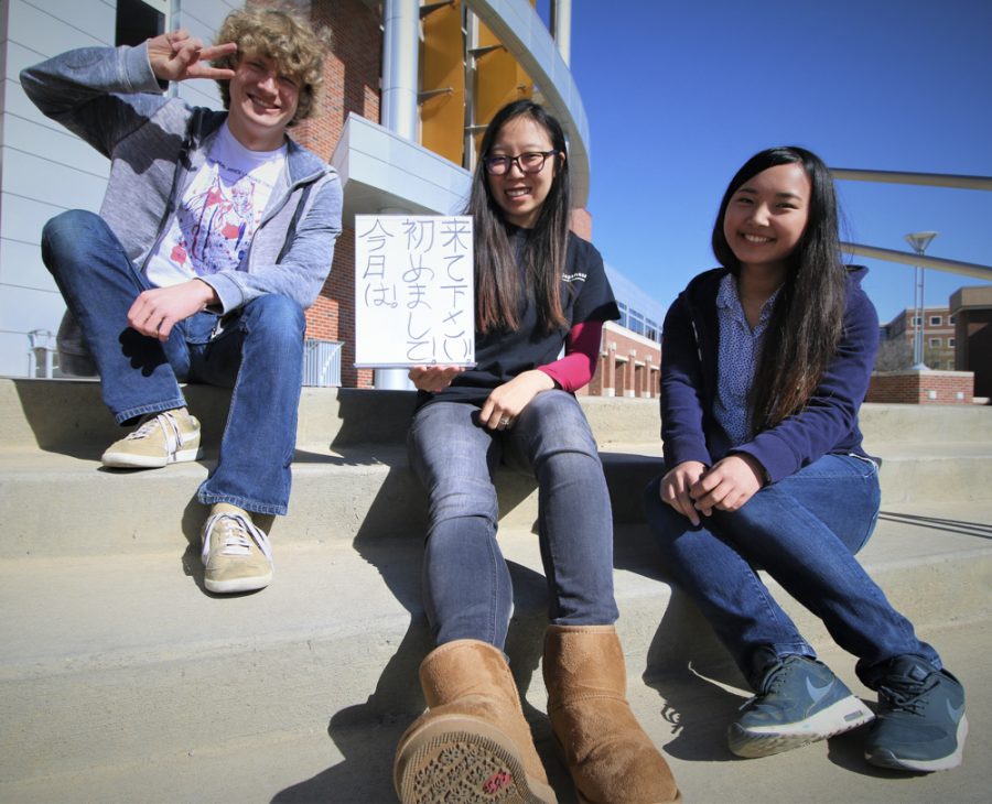 Representatives from left to right: Davis Peck, Irena Kutilek and  Akari Yoshioka. Kutilek brandishes a sign encouraging students to stop by Japan Festival on Wednesday April 21 at the RSC.