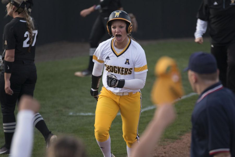 Wichita State junior Bailey Lange runs for home plate in the last inning of the first game against UCF Friday evening. 