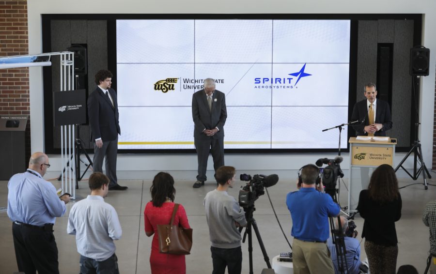 President and CEO of Spirit AeroSystems Tom Gentile, right, speaks along side Wichita State President John Bardo, center, and Trevor Steinbrock, left, during an event announcing a partnership building with Spirit AeroSystems  and Wichita State University.