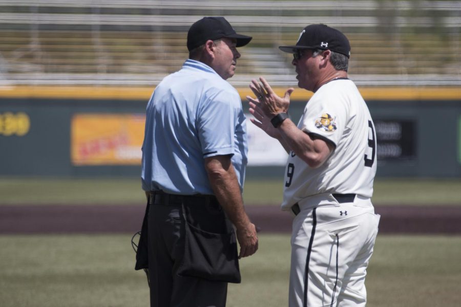 Wichita State Head Coach Todd Butler argues over a call made by the umpire during the third game of the series against Cincinnati Sunday afternoon.