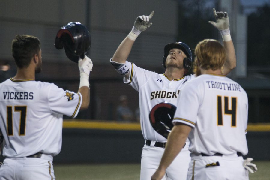 Wichita State's Greyson Jenista celebrates after hitting a home run against USF Friday evening during the first game of the weekend series at Eck Stadium.