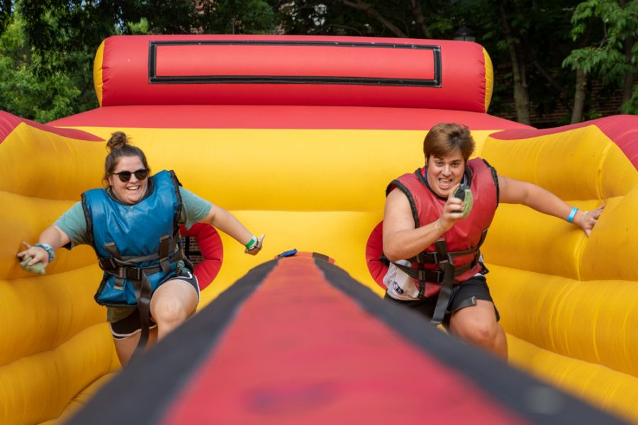 Courteney Castle (left) and Gabe Robertson (right) compete on a blow up at the Back to School Bash on August 18, 2018.