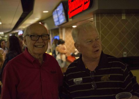 Freddy Simon interacts with Gordon Vadakin, head coach of the WSU bowling team, at the soft-opening of Freddy's Frozen Custard & Steakburgers at Wichita State. The location is in the Rhatigan Student Center.