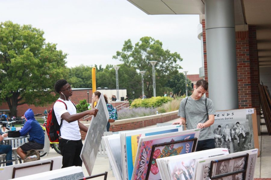 Students check out prints for sale outside the RSC.