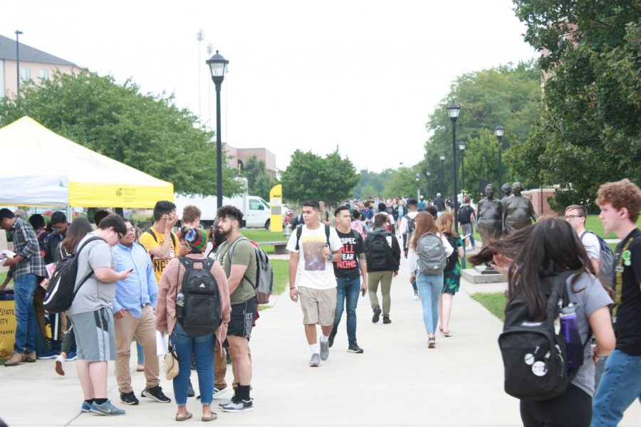 Students mill about on campus during the first day of classes. 