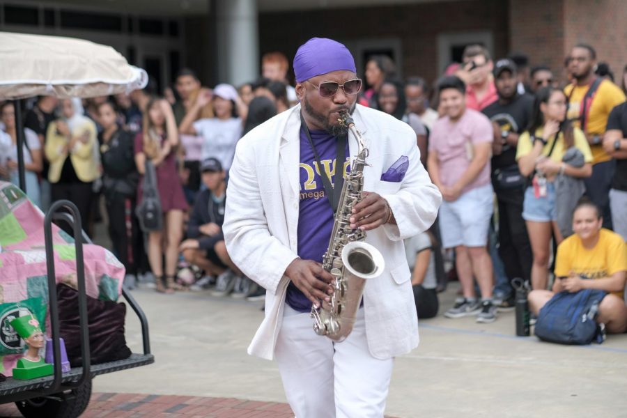 Kevin Harrison, community engagement coordinator of Diversity and Community Engagement, plays saxophone to begin the Shock the Yard event.
