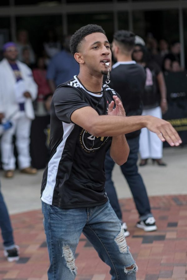 Caleb Strong, Mechanical Engineeing and Computer Science student, performs with Alpha Phi Alpha Fraternity.