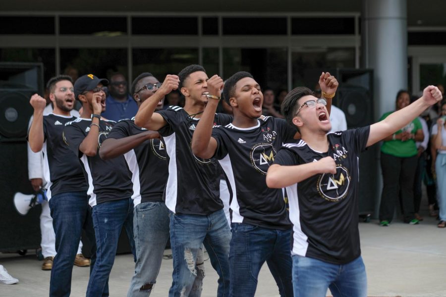 Alpha Phi Alpha Fraternity lines up and dances together. They created a unison moment that attracts students.