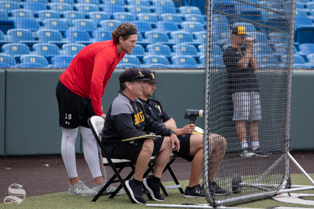 Alec Bohm, drafted 3rd overall by the Philadelphia Phillies in the 2018 MLB Draft, watches WSU Baseball practice at Eck Stadium on Sep. 8, 2018. Bohm is seen next Head Coach Todd Butler and Sam Goodwin.