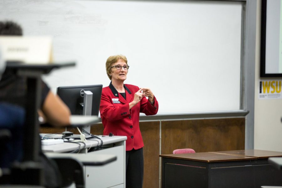 Betty Smith-Campbell, Faculty Senate President, leads the faculty senate meeting in Clinton Hall, Monday, Sept. 24, 2018.