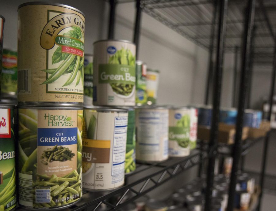 Cans are stacked in the Shocker Food Locker.